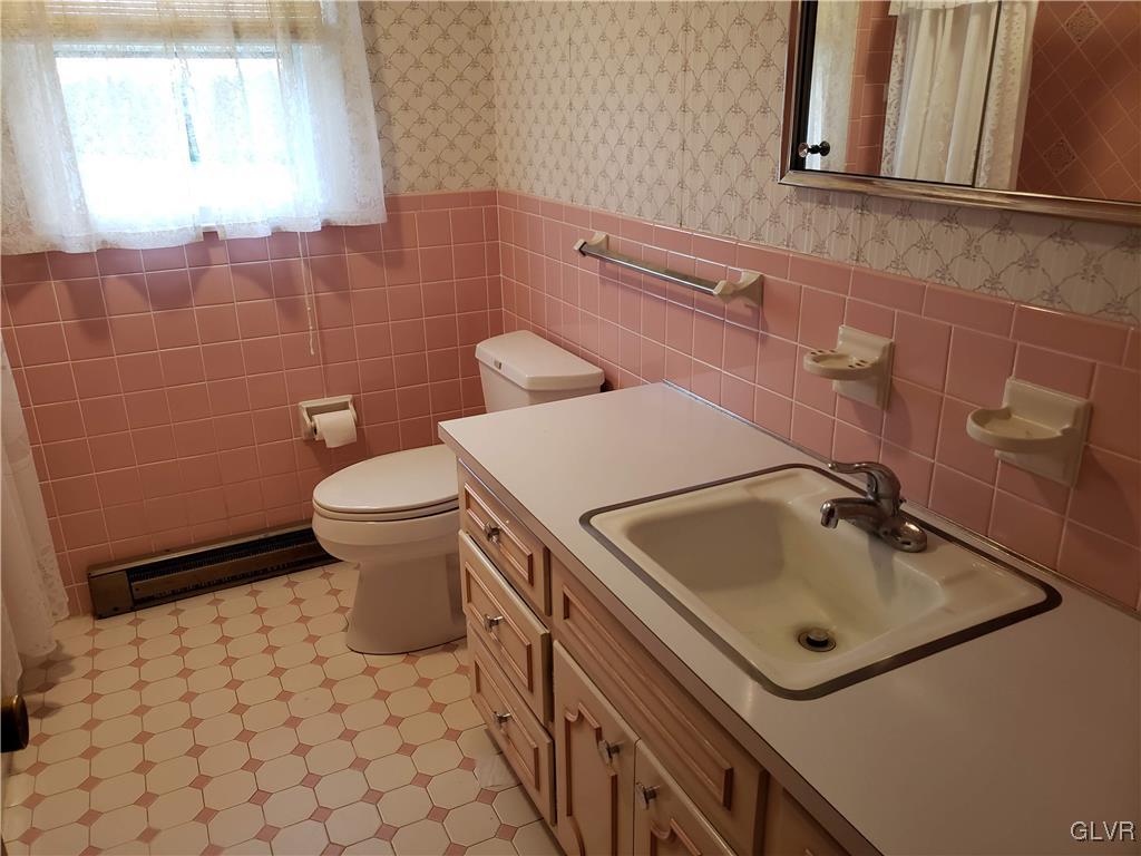 2341 Yost Road Bath, PA 18014 - Photo 17 of 24 a bathroom with a sink toilet and mirror