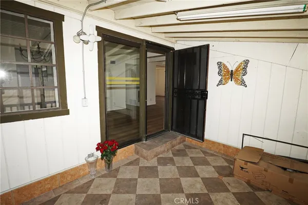 a view of a room with wooden floor and cabinet