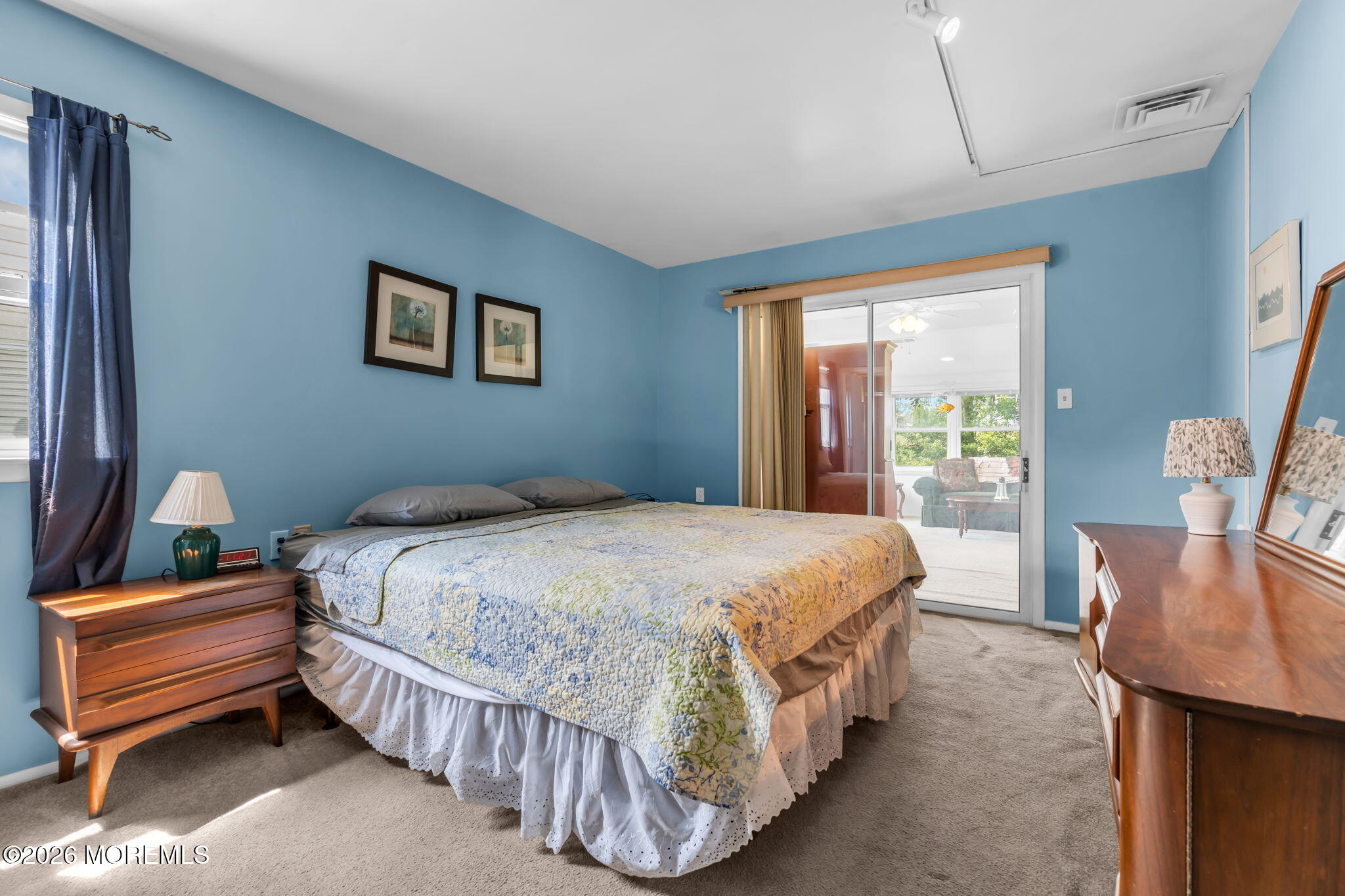 67 Blake Circle Brick, NJ 08724 - Photo 25 of 34 a bedroom with a bed a window and dresser
