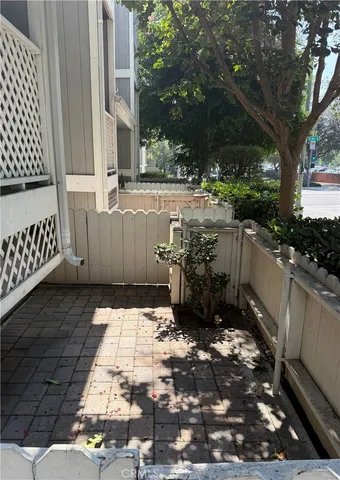 a view of a backyard with sitting area