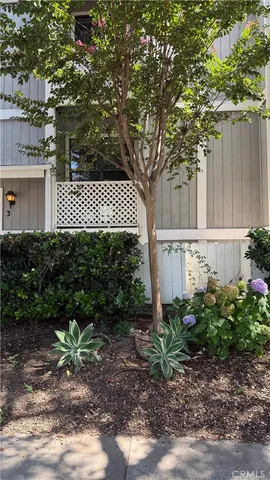 a house with a tree in front of it