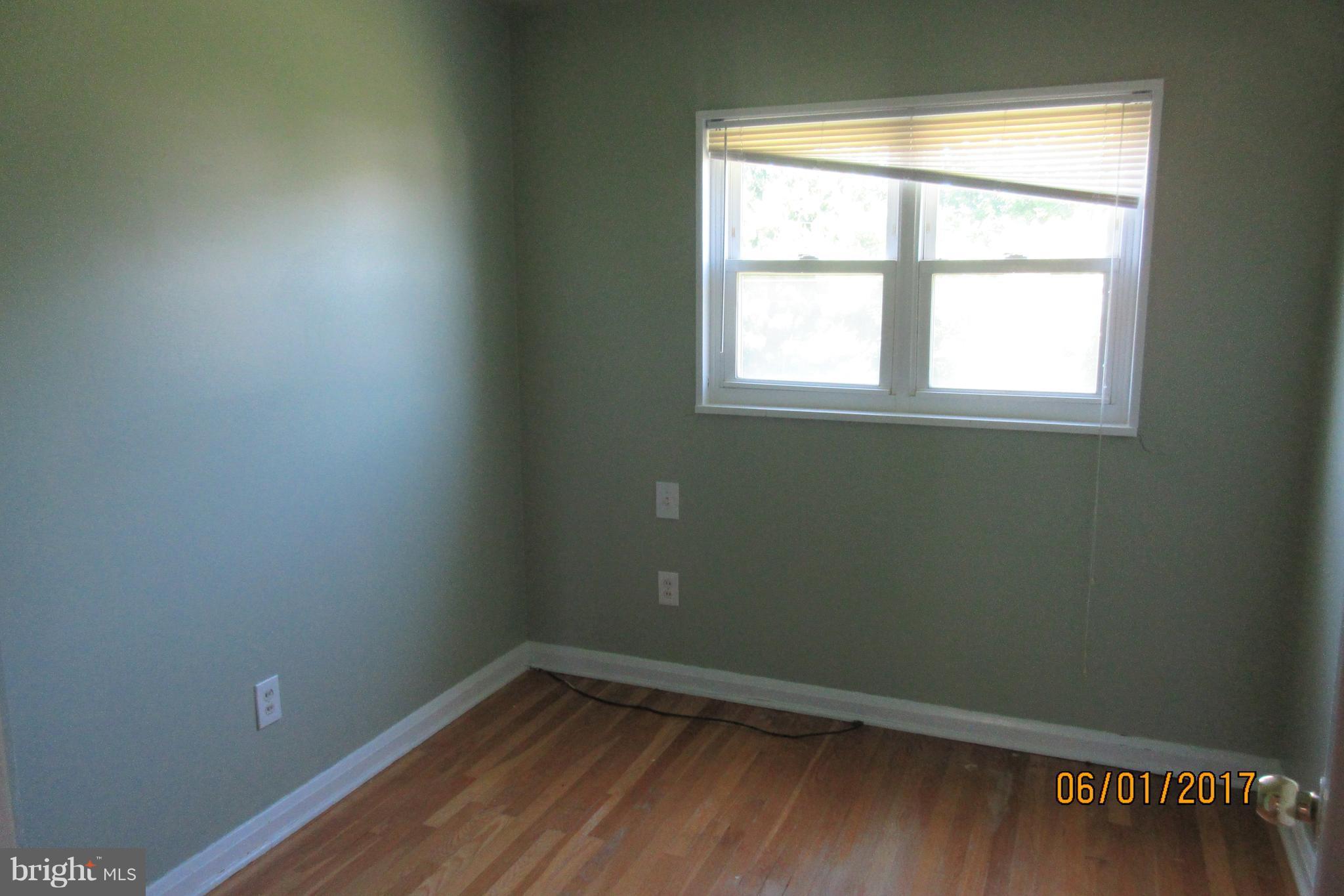 6209 Johnnycake Road Baltimore, MD 21207 - Photo 14 of 15 an empty room with a window
