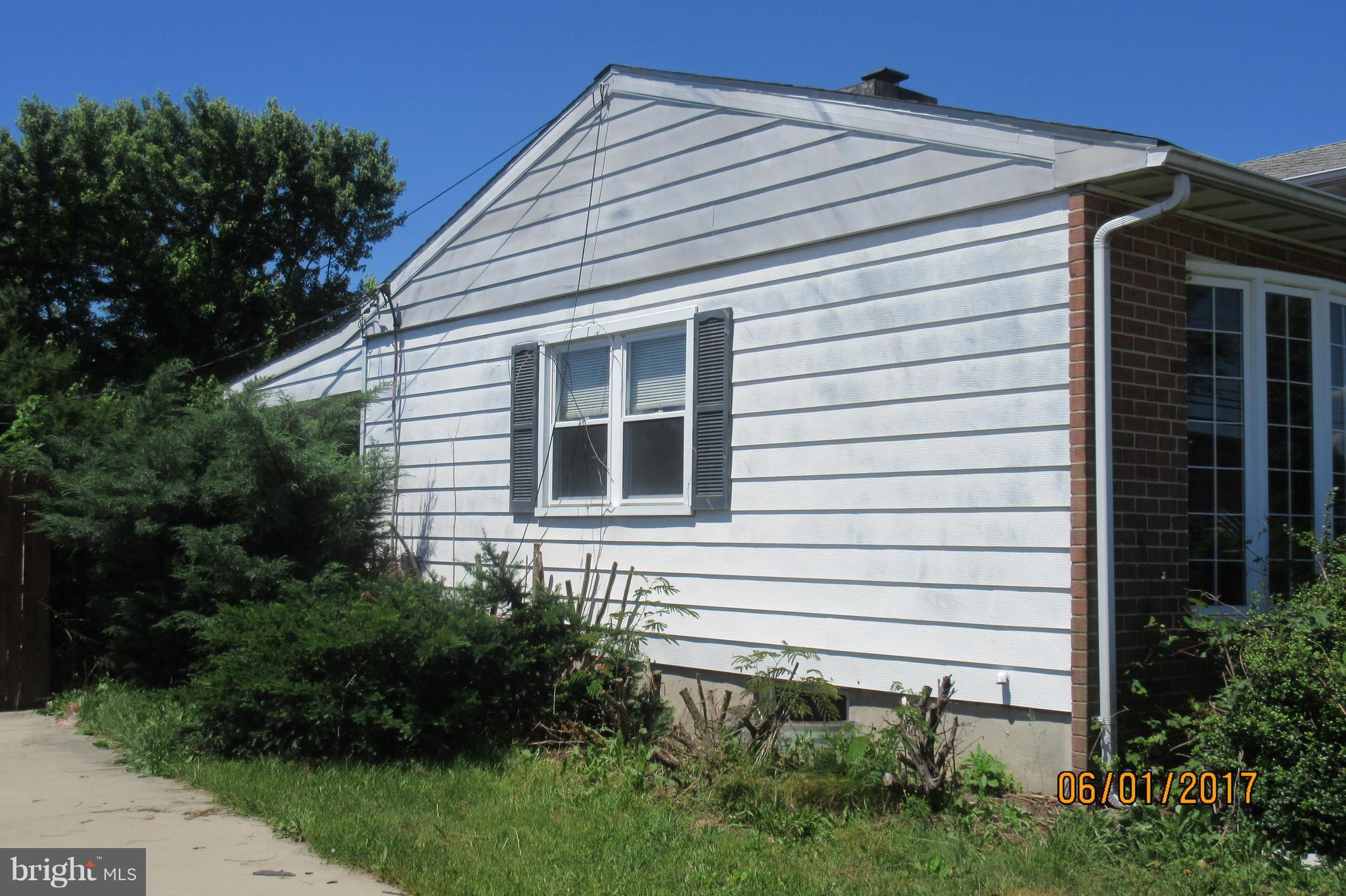 6209 Johnnycake Road Baltimore, MD 21207 - Photo 4 of 15 a view of a house with a yard