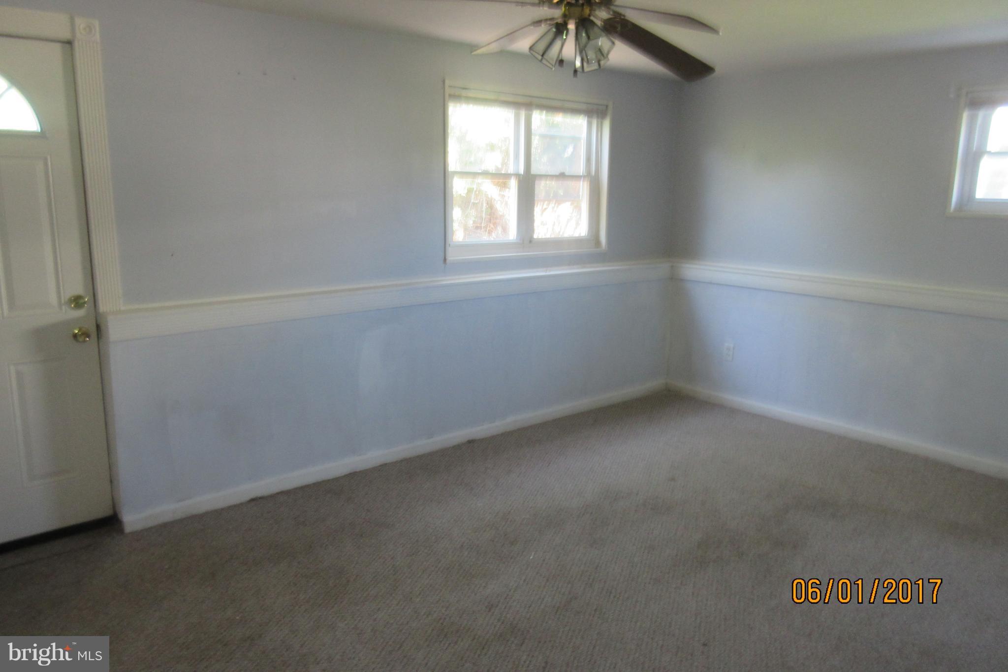 6209 Johnnycake Road Baltimore, MD 21207 - Photo 9 of 15 an empty room with a window