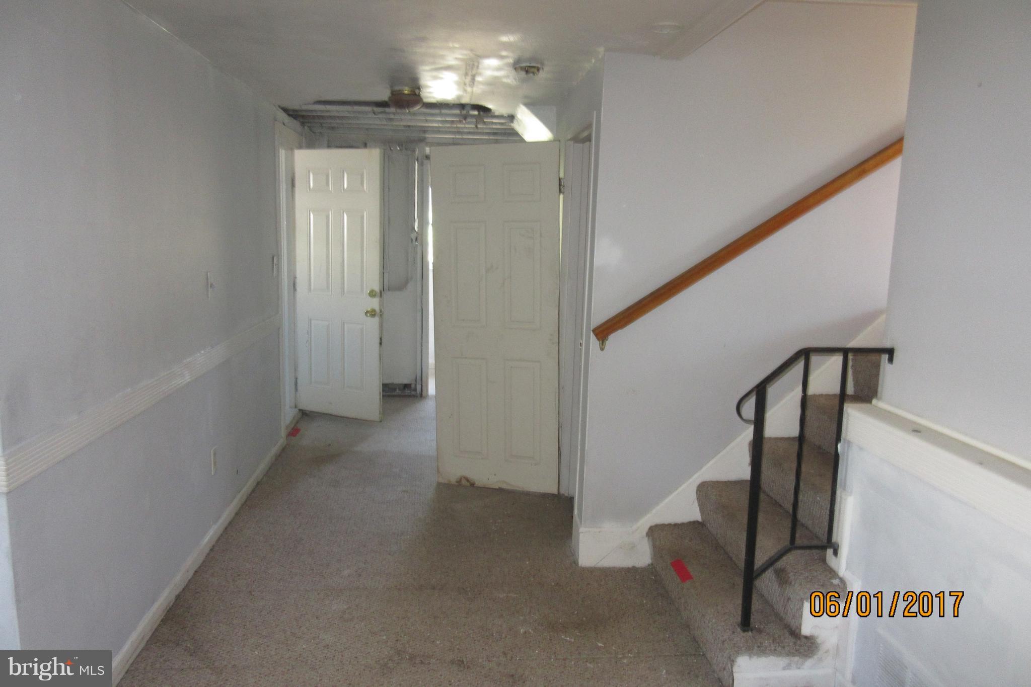 6209 Johnnycake Road Baltimore, MD 21207 - Photo 10 of 15 a view of a hallway with staircase