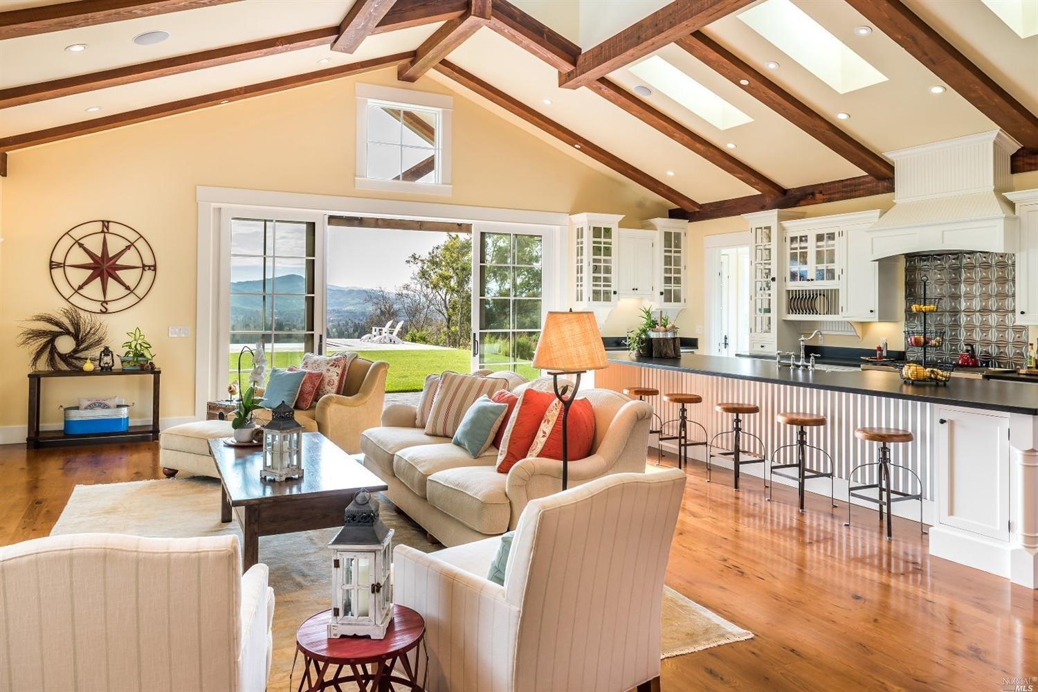 3975 Wallace Road Santa Rosa, CA 95404 - Photo 1 of 1 a living room with furniture and a floor to ceiling window