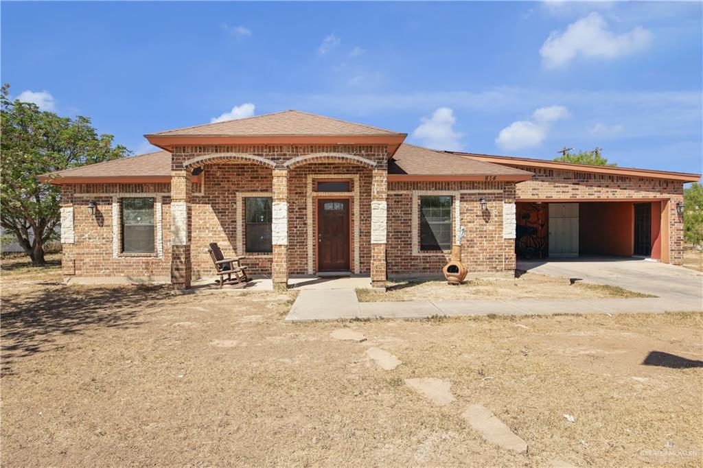 814 West 2nd Street Mission, TX 78572 - Photo 2 of 25 a front view of a house with a patio