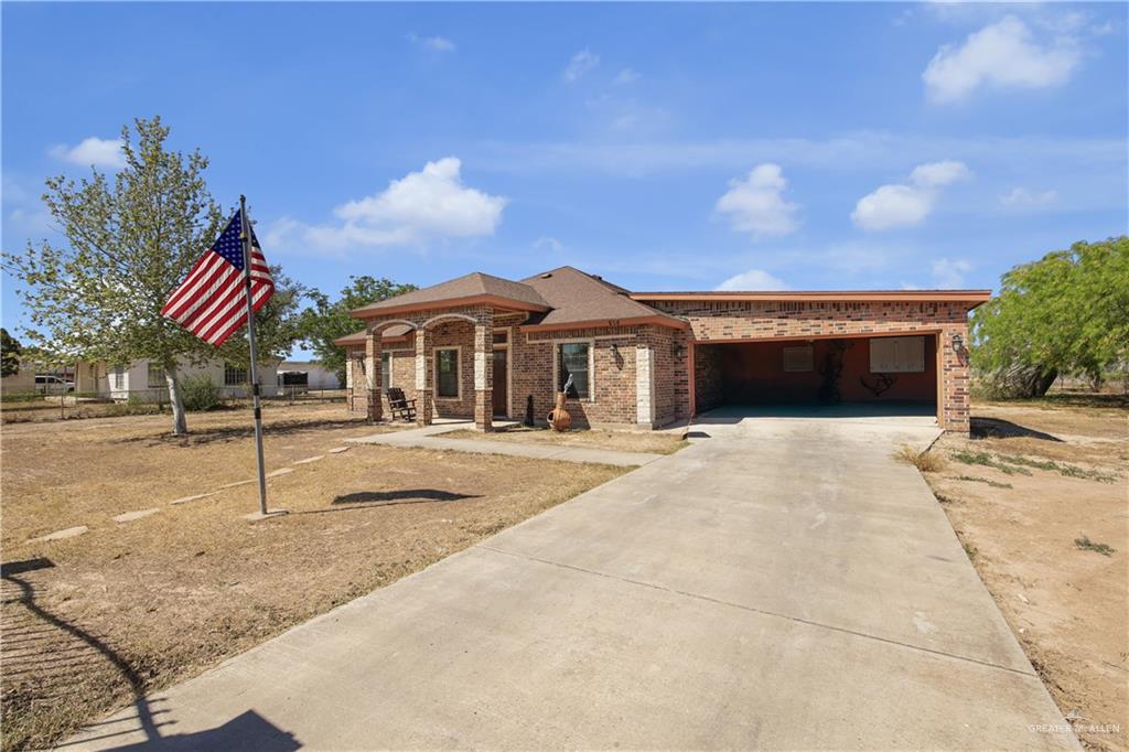 814 West 2nd Street Mission, TX 78572 - Photo 4 of 25 a house with yard in front of it