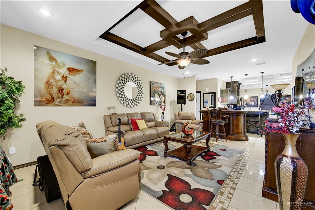 814 West 2nd Street Mission, TX 78572 - Photo 5 of 25 a living room with lots of furniture and kitchen view