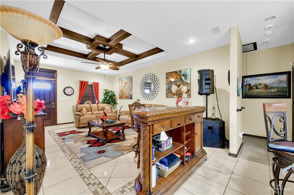 814 West 2nd Street Mission, TX 78572 - Photo 7 of 25 a living room with lots of furniture and kitchen view