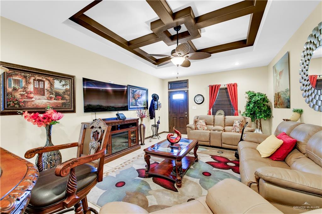 814 West 2nd Street Mission, TX 78572 - Photo 9 of 25 a living room with furniture and a flat screen tv