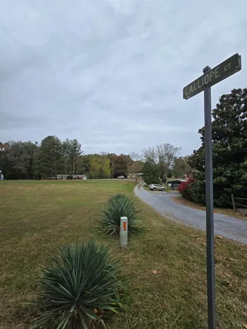 a view of a lake with a big yard