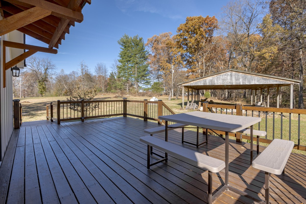 2900 Tanyard Hill Road Lynchburg, TN 37352 - Photo 79 of 83 a view of a chairs and table on the wooden floor