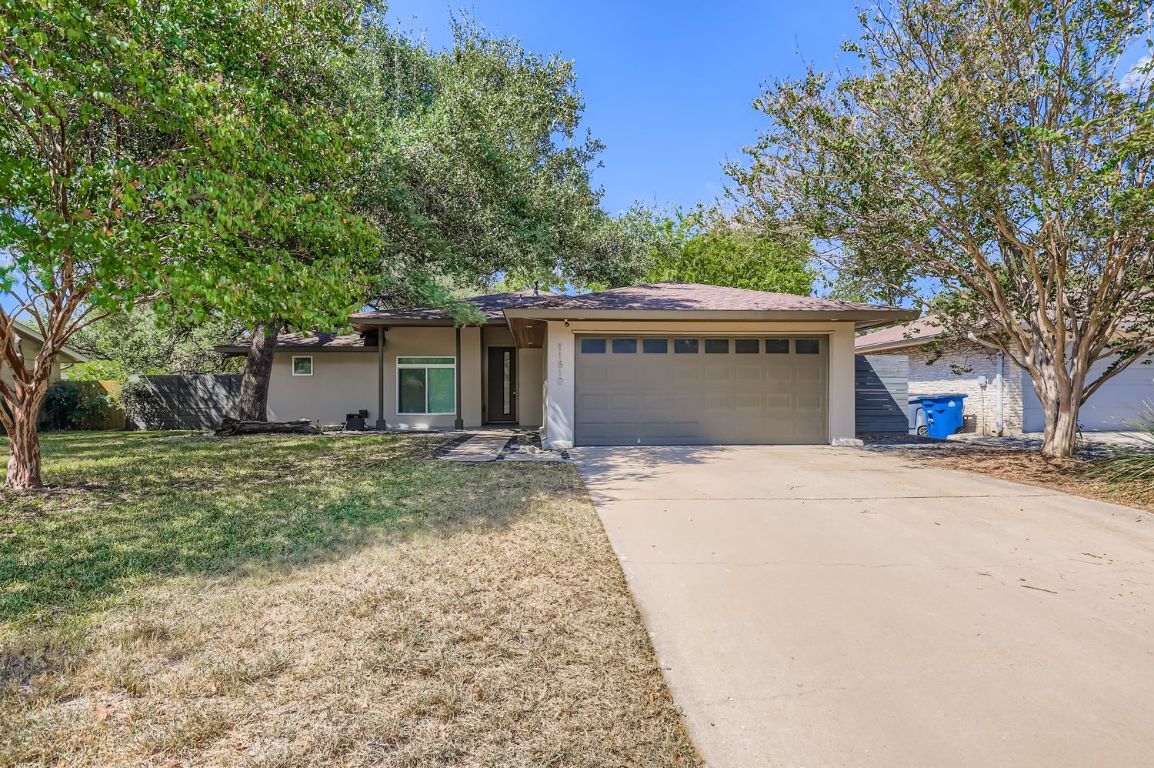 11810 Charing Cross Road Austin, TX 78759 - Photo 1 of 1 front view of a house with a yard