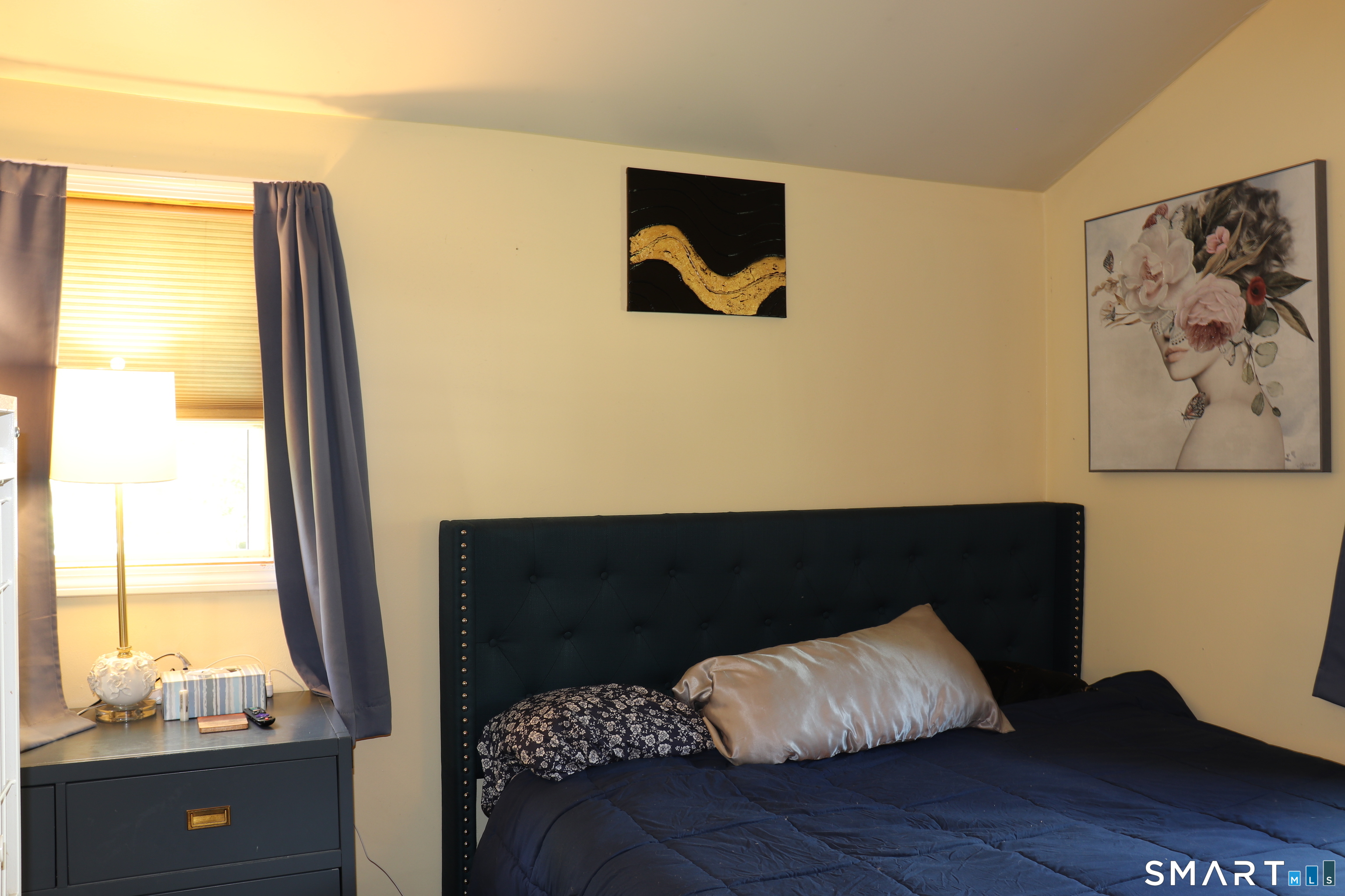 308 Abbe Road Enfield, CT 06082 - Photo 22 of 33 a bed sitting in a bedroom next to a window