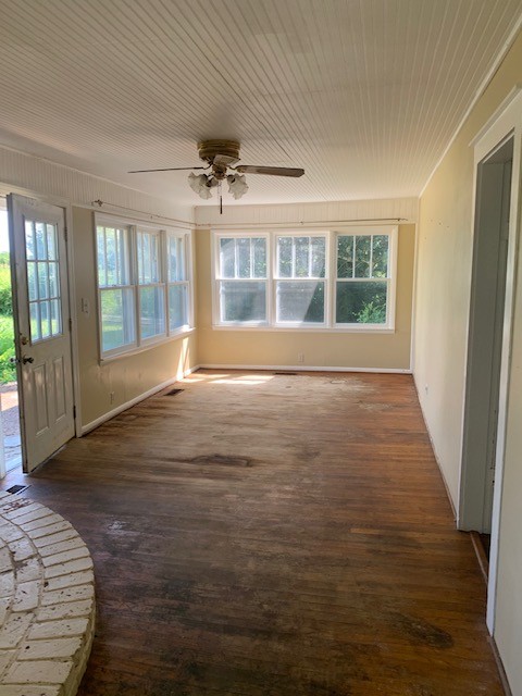 1919 Bethel Road Pulaski, TN 38478 - Photo 5 of 16 a view of an empty room with wooden floor and a window