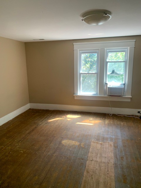 1919 Bethel Road Pulaski, TN 38478 - Photo 8 of 16 an empty room with wooden floor and windows