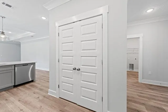 wooden floor with white cabinets and wooden floor
