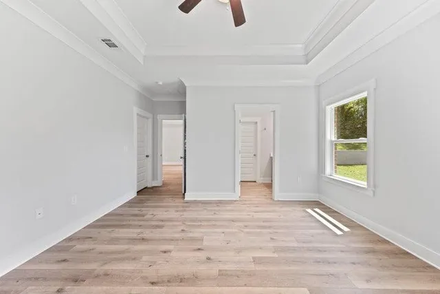 a view of an empty room with a window