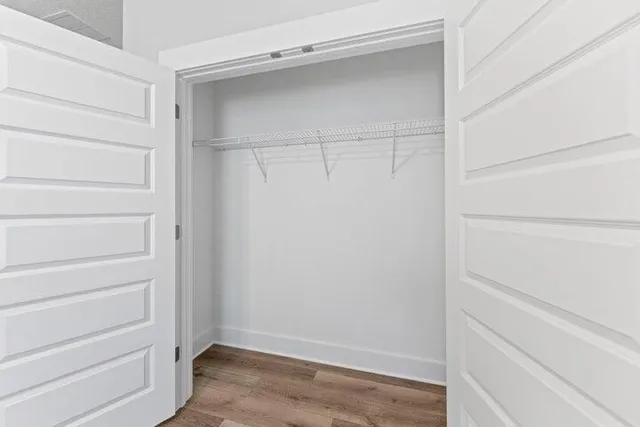 a view of an empty walk in closet