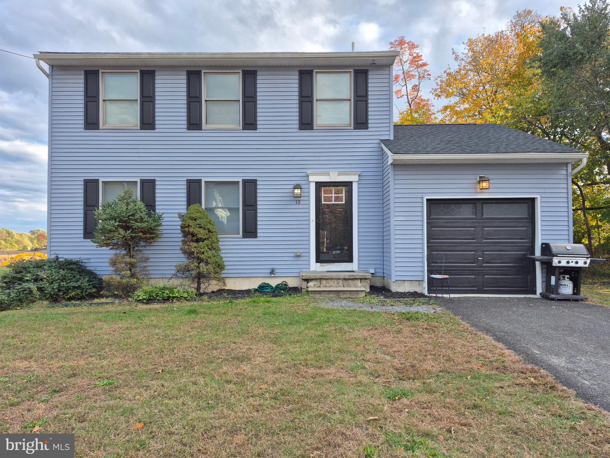 10 Carter Drive Deptford, NJ 08096 - Photo 1 of 22 a front view of a house with a yard and garage
