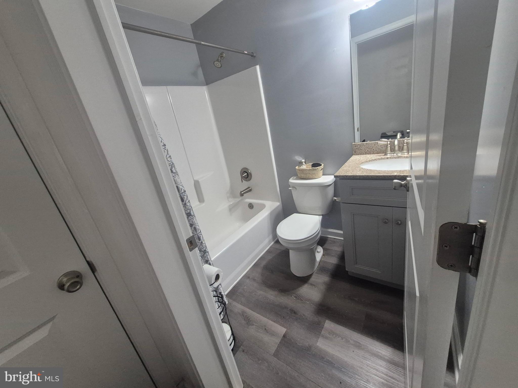 10 Carter Drive Deptford, NJ 08096 - Photo 11 of 22 a bathroom with a sink and mirror with toilet