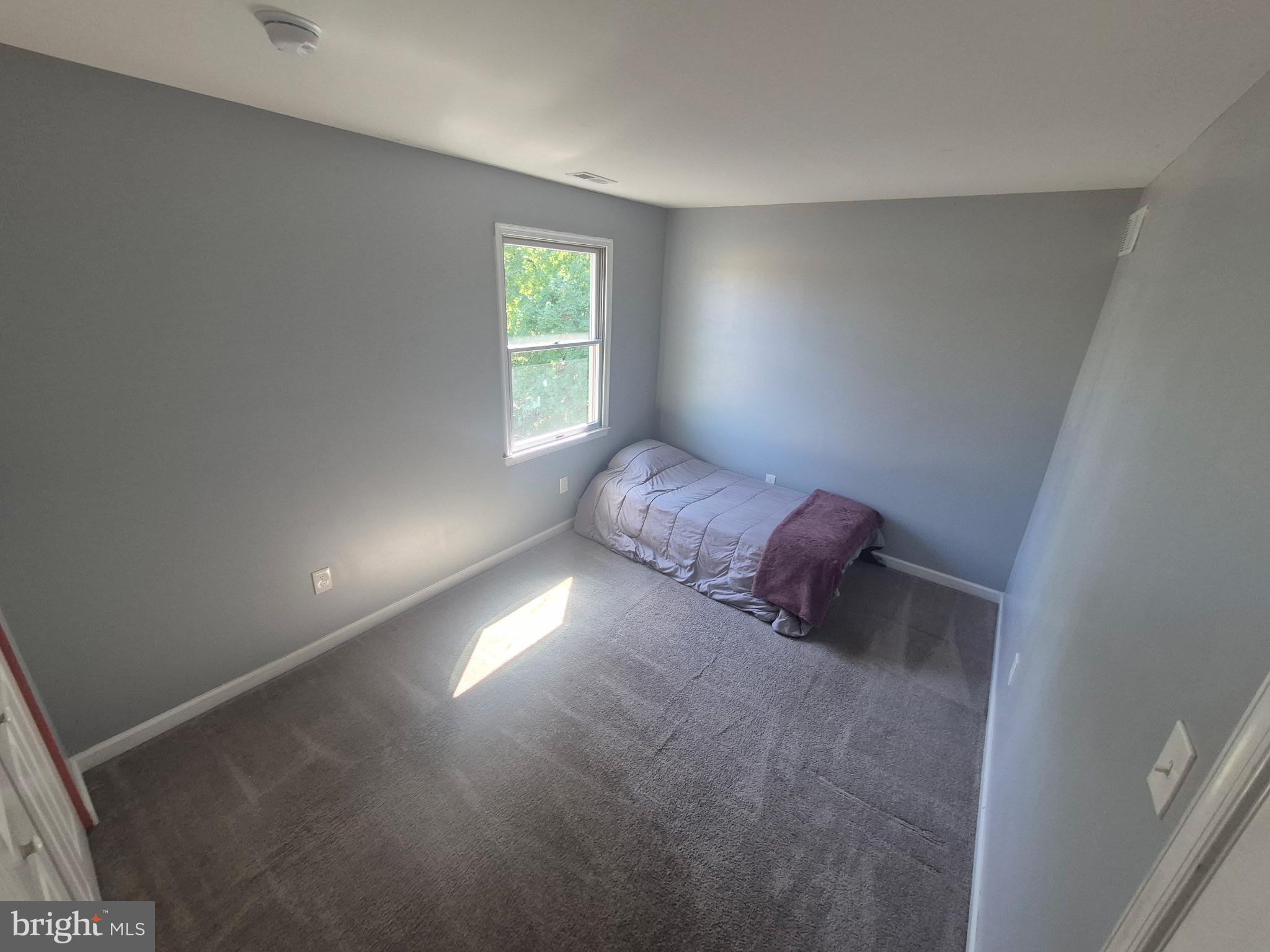 10 Carter Drive Deptford, NJ 08096 - Photo 18 of 22 a room with a bed and a window