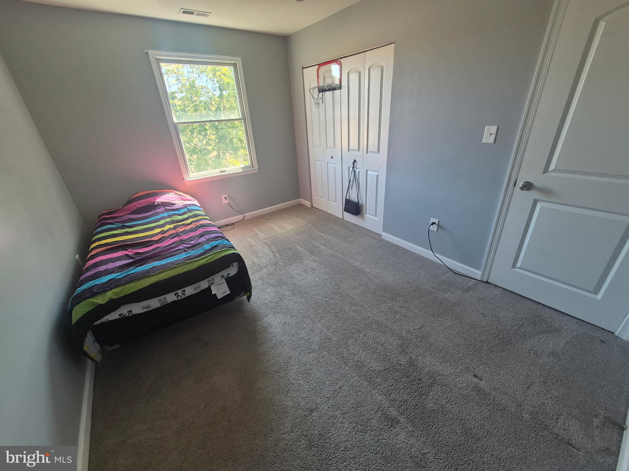 10 Carter Drive Deptford, NJ 08096 - Photo 19 of 22 a room with a bed and a window
