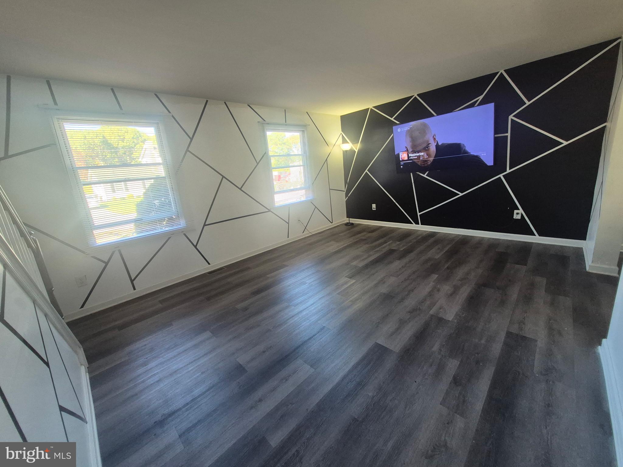 10 Carter Drive Deptford, NJ 08096 - Photo 5 of 22 an empty room with wooden floor and windows