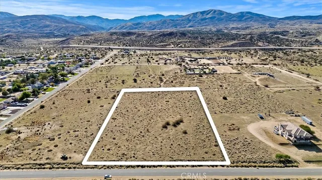 a view of a mountain from the ocean view
