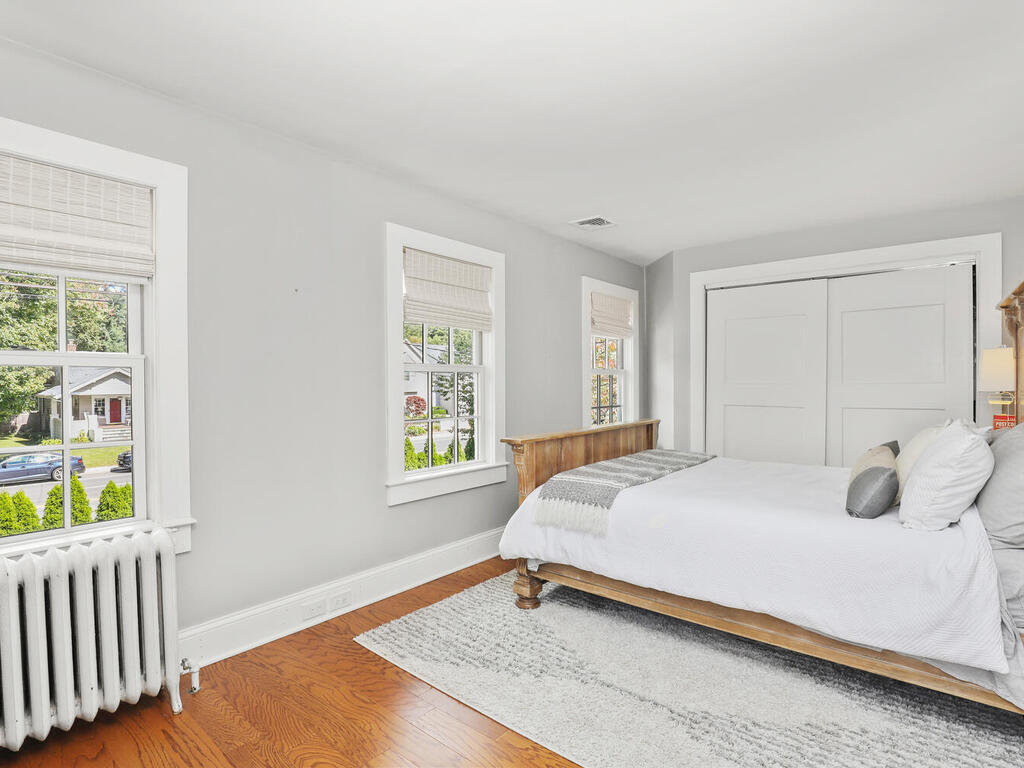 2636 Boston Post Road Darien, CT 06820 - Photo 14 of 28 a bedroom with a bed and a window