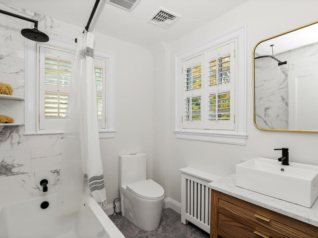 2636 Boston Post Road Darien, CT 06820 - Photo 16 of 28 a bathroom with a sink a toilet and shower