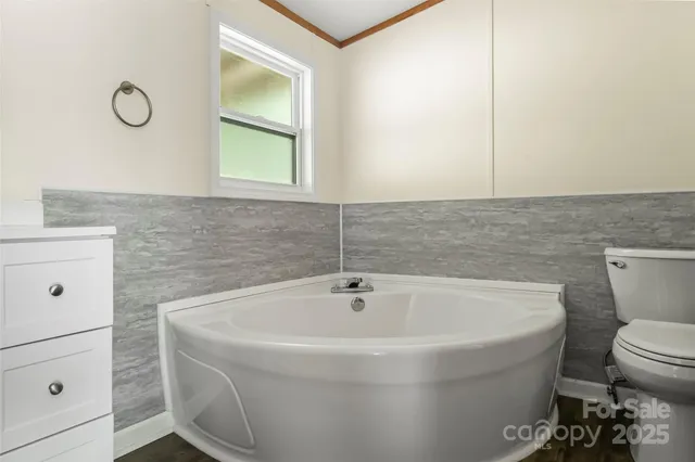 a bathroom with a toilet and a sink