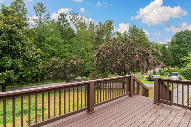 a view of balcony with wooden floor