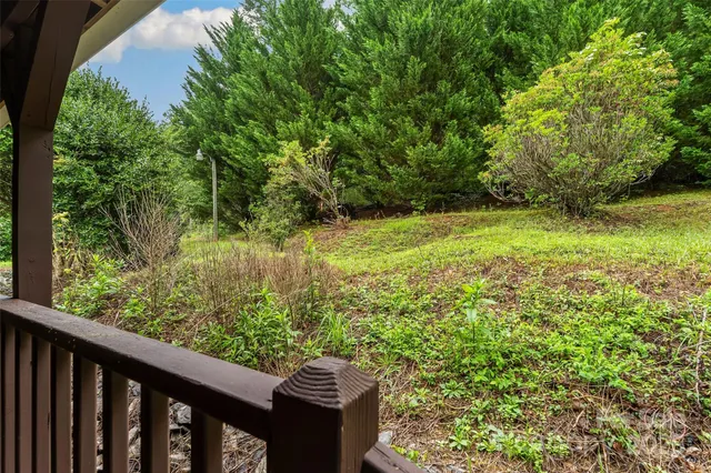 a view of a yard from a balcony