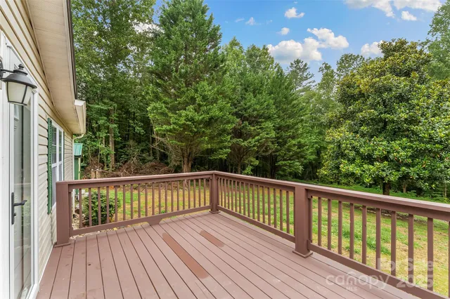a view of balcony with wooden floor