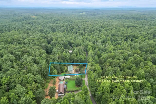 an aerial view of residential house with outdoor space
