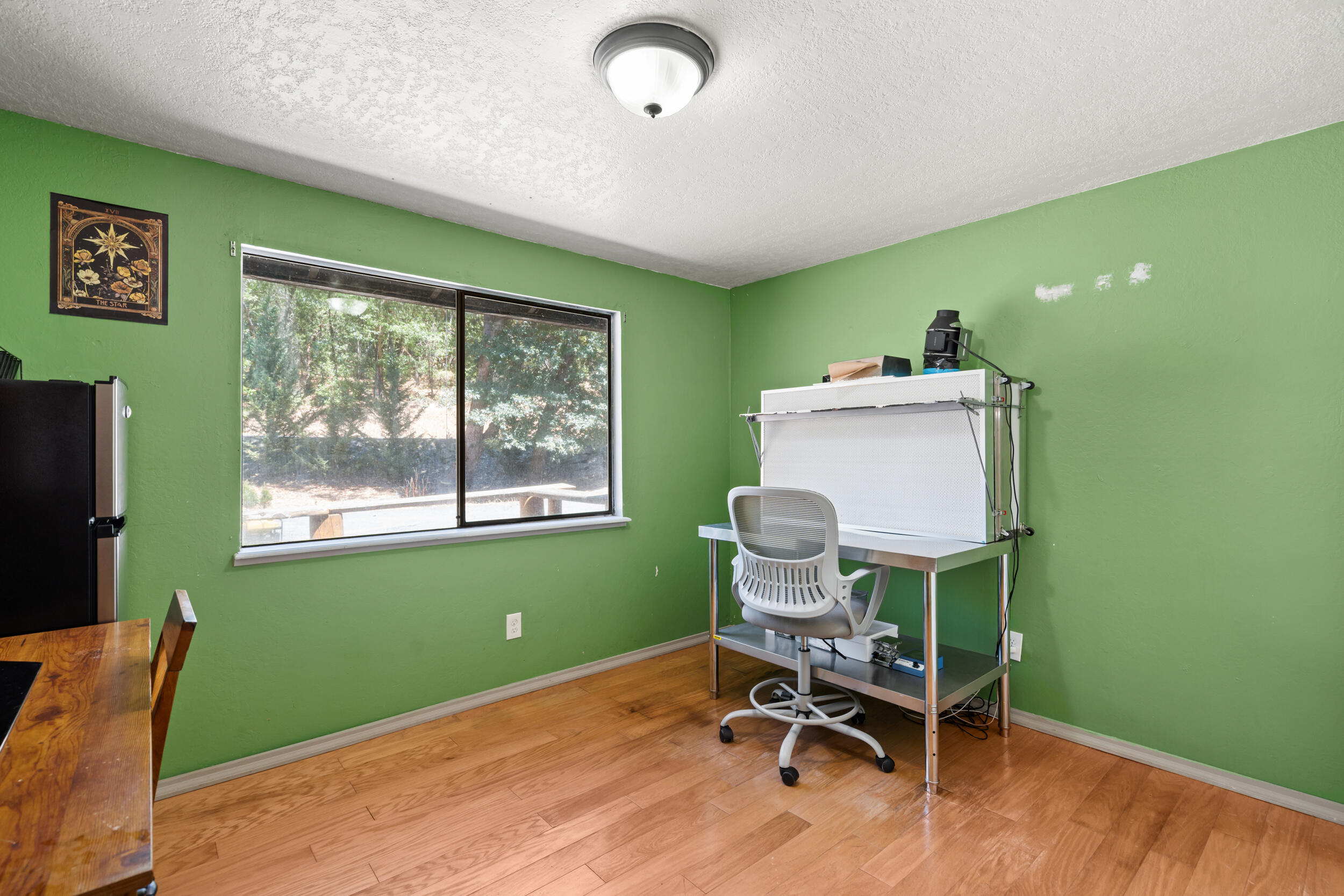 1000 Three Pines Road Grants Pass, OR 97526 - Photo 16 of 37 a workspace with furniture and a window