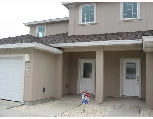 a kitchen with a stove and more cabinets