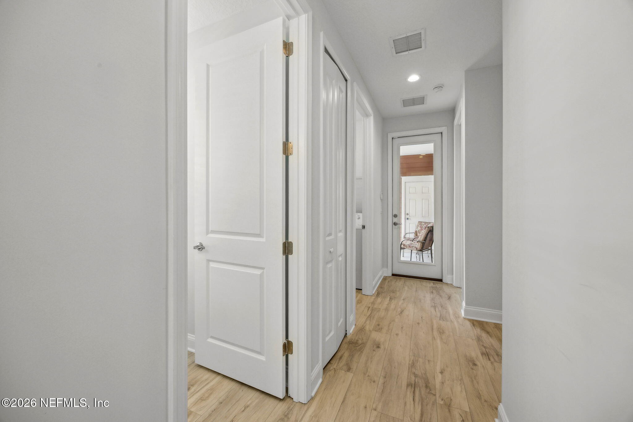 230 Wildlight Avenue Yulee, FL 32097 - Photo 12 of 73 a view of a hallway with wooden floor