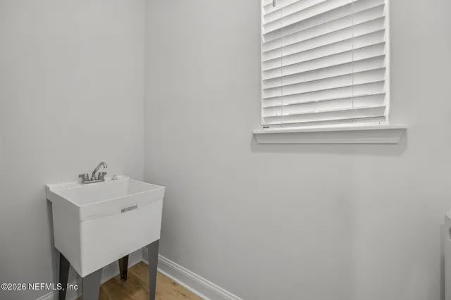 a view of a lake with a table and chairs