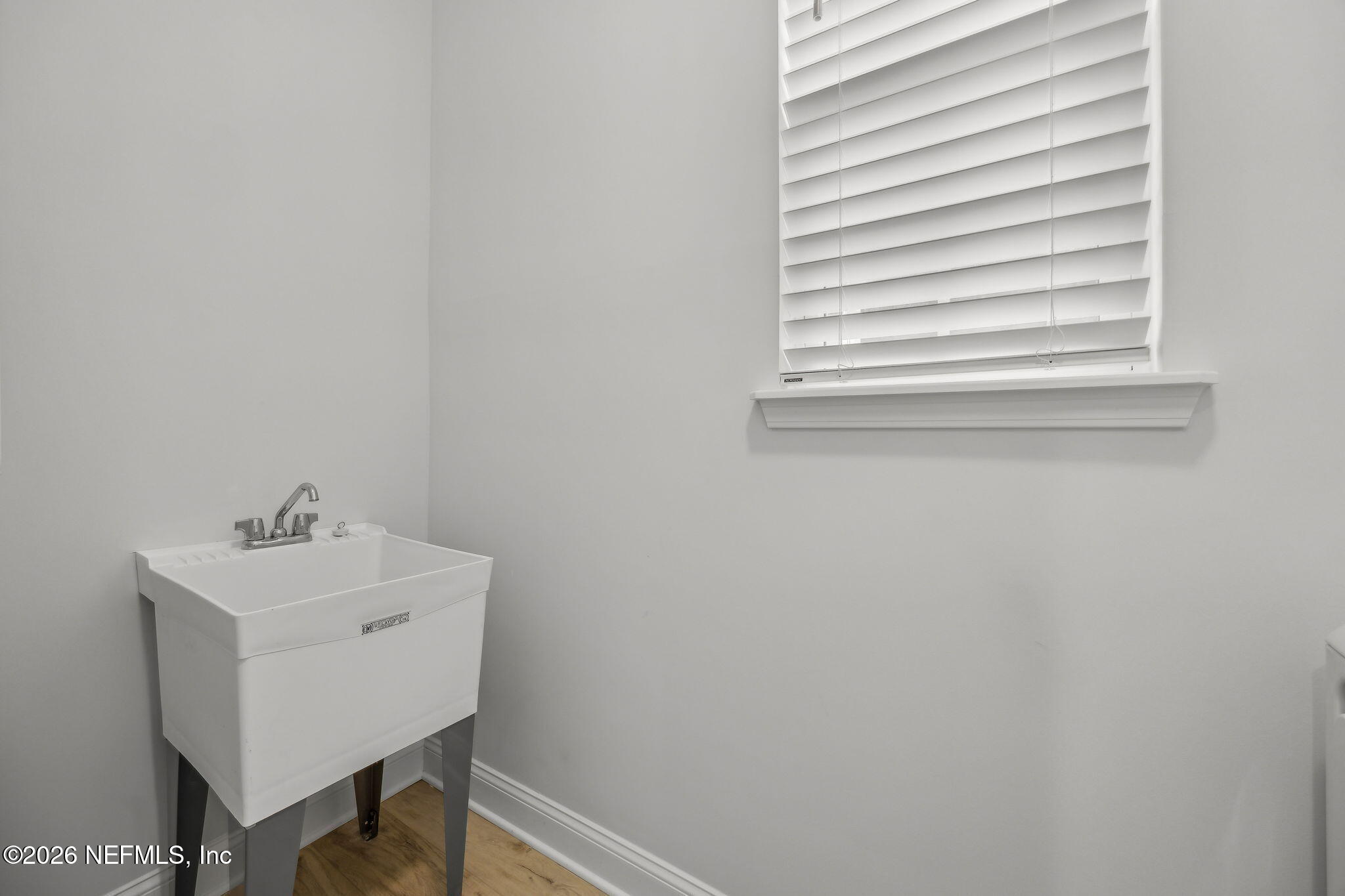 230 Wildlight Avenue Yulee, FL 32097 - Photo 15 of 73 a bathroom with a sink and a window