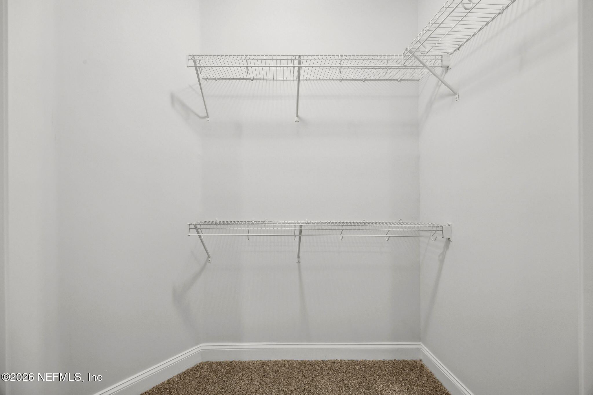 230 Wildlight Avenue Yulee, FL 32097 - Photo 21 of 73 a view of a room with racks on the wall