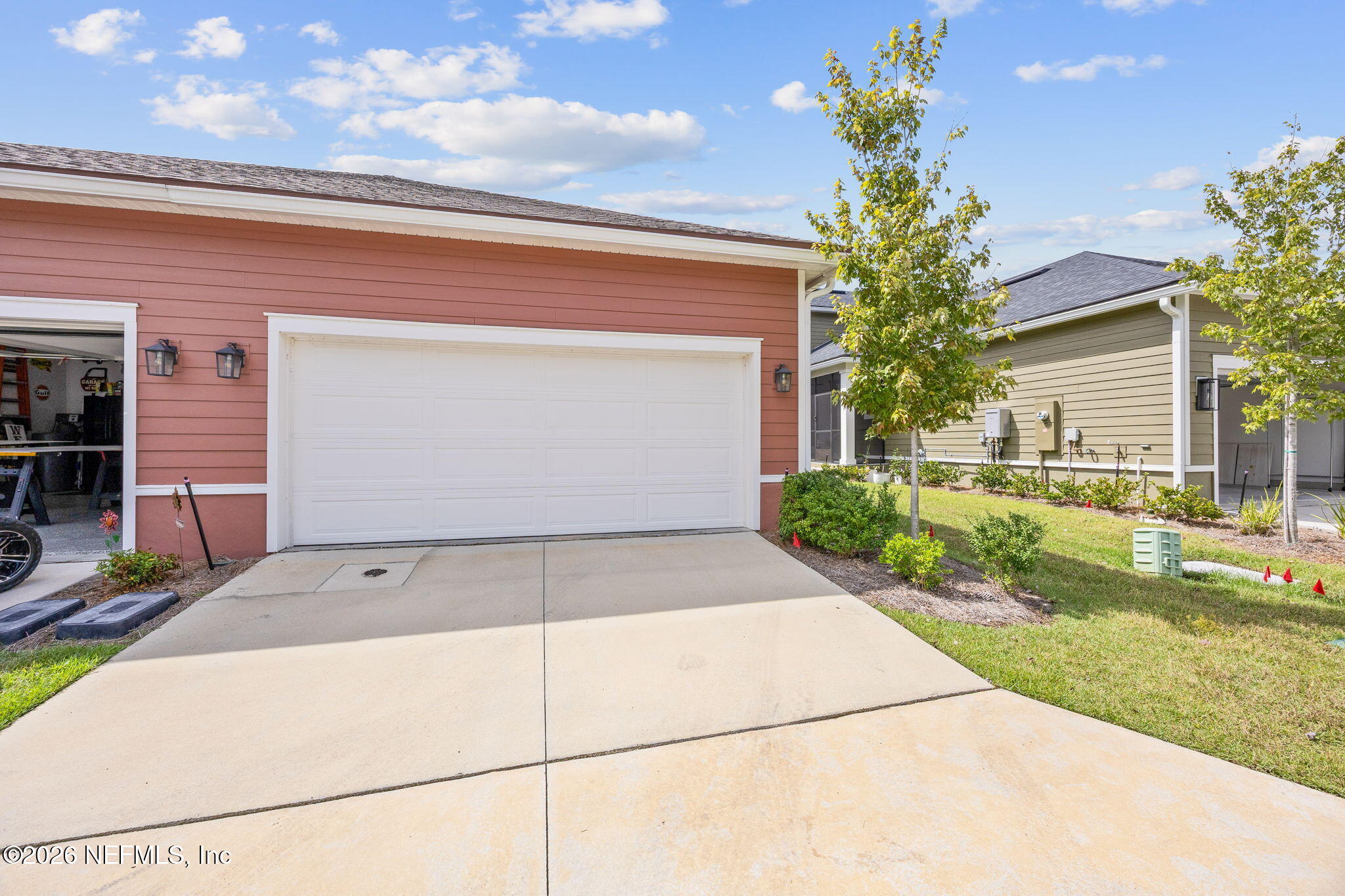 230 Wildlight Avenue Yulee, FL 32097 - Photo 34 of 73 a front view of a house with garden