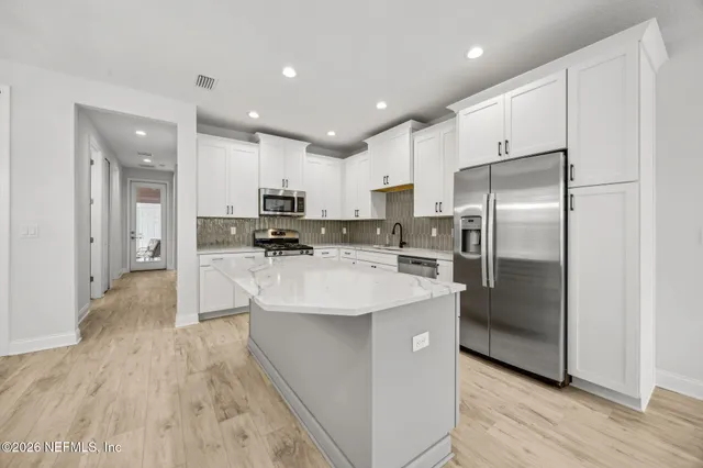 a bathroom with a bathtub and a toilet