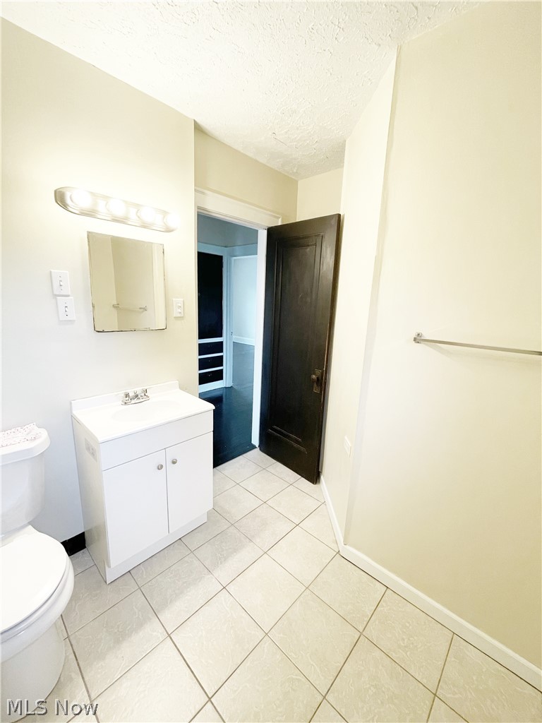 3345 Sylvanhurst Road Cleveland Heights, OH 44112 - Photo 10 of 16 Bathroom with oversized vanity, tile floors, and toilet