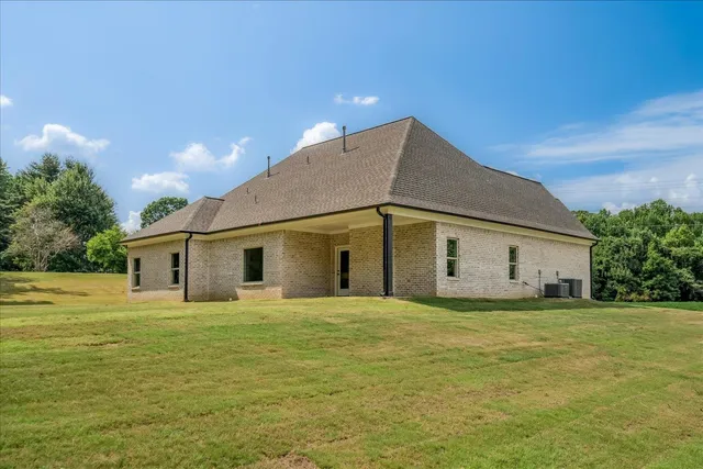 a house with yard in front of it