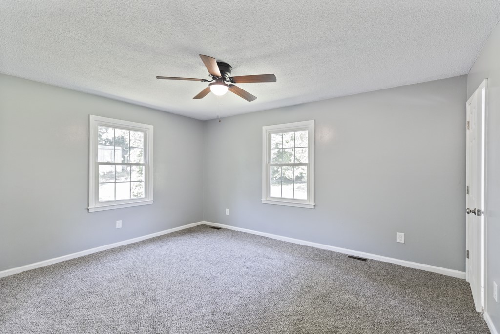 104 Doyle Drive Seneca, SC 29678 - Photo 12 of 19 This airy bedroom offers comfort and a blank canvas for your personal touch.