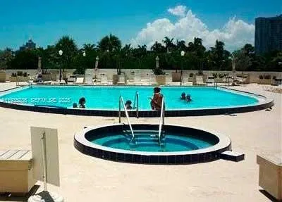 a view of a swimming pool with a patio