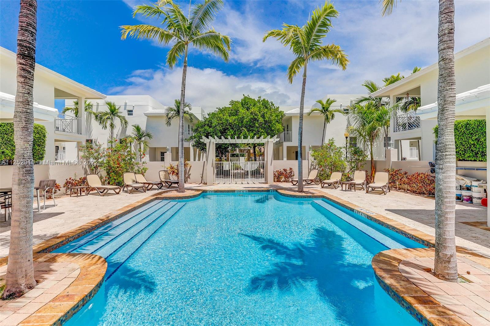 1037 Southwest 9th Court, Unit E1 Miami, FL 33130 - Photo 1 of 26 a view of a swimming pool with a patio